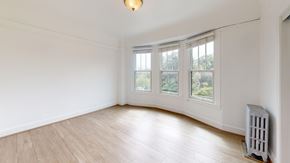 San Francisco apartment for rent - A room with a white wall and a window with a white frame.