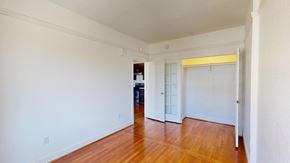 San Francisco apartment for rent - A room with white walls and wooden floors.