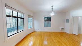 San Francisco apartment for rent - A room with wooden floors and white walls.