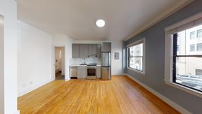 San Francisco apartment for rent - A kitchen with wooden floors and white walls.