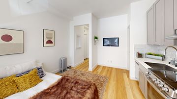 San Francisco apartment for rent - A modern kitchen with a stainless steel sink and a brown area rug.