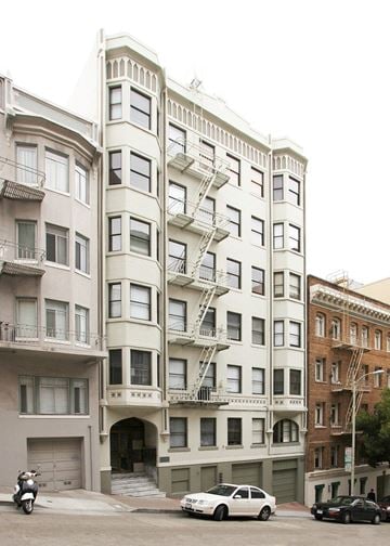 San Francisco apartment for rent - a building with a fire escape on the side of a street