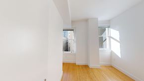 San Francisco apartment for rent - A room with white walls and wooden flooring with a window.