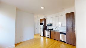 San Francisco apartment for rent - A kitchen with wooden floors and white walls.