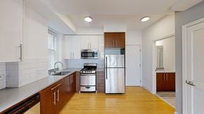 San Francisco apartment for rent - A modern kitchen with wooden cabinets and stainless steel appliances.
