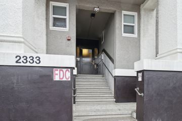 Berkeley apartment for rent - The stairs leading to the door of a building with the number 2333 and the letters FDC on the wall.