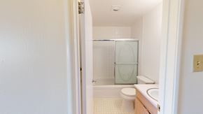 San Francisco apartment for rent - A white bathroom with a toilet, sink and shower.