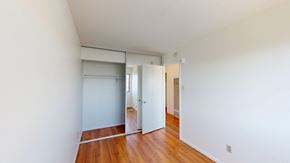San Francisco apartment for rent - A room with a white wall and a wooden floor.