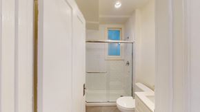 San Francisco apartment for rent - A white bathroom with a toilet, sink, and shower.