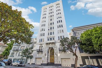 San Francisco apartment for rent - A tall white building with a black door in front.