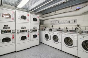 San Francisco apartment for rent - Laundry room with a row of washing machines and dryers
