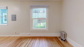 San Francisco apartment for rent - A room with a window and a radiator on the floor.