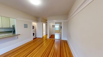 San Francisco apartment for rent - A long hallway with wood floors and white walls.