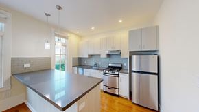 San Francisco apartment for rent - A modern kitchen with stainless steel appliances and wooden floors.
