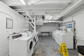 San Francisco apartment for rent - Laundry room with a row of washing machines and dryers