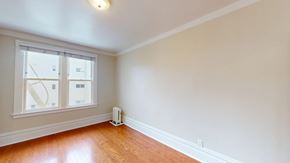 San Francisco apartment for rent - A room with a window and a white wall.