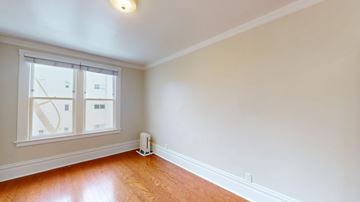 San Francisco apartment for rent - A room with a window and a white wall.
