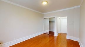 San Francisco apartment for rent - A room with a wooden floor and white walls.