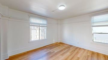 San Francisco apartment for rent - A room with wooden floors and white walls.