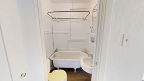 San Francisco apartment for rent - A white bathroom with a toilet, sink, and bathtub.