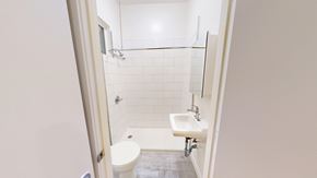 San Francisco apartment for rent - A white toilet is in a small bathroom with a white sink.
