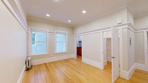 San Francisco apartment for rent - A room with wooden floors and white walls.