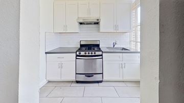 San Francisco apartment for rent - A modern kitchen with a stove and cabinets.