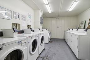 San Francisco apartment for rent - Laundry room with washing machines neatly arranged on a wooden floor