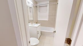 San Francisco apartment for rent - A white bathroom with a toilet, sink, and bathtub.
