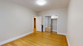 San Francisco apartment for rent - A room with wooden floors and a white wall.