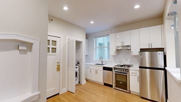 San Francisco apartment for rent - A modern kitchen with stainless steel appliances and wooden floors.