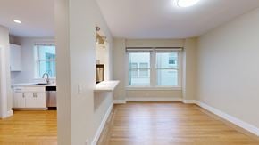 San Francisco apartment for rent - A large empty room with wooden floors and a window.