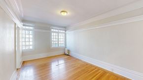 San Francisco apartment for rent - A room with wooden floors and white walls with a window.