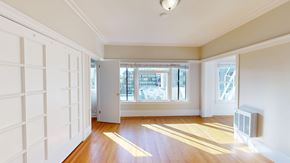 San Francisco apartment for rent - A room with white walls and wooden flooring with a window and a door.