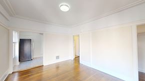 San Francisco apartment for rent - A spacious room with a wooden floor and white walls.