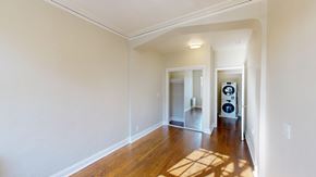 San Francisco apartment for rent - A room with a white wall and a wooden floor.