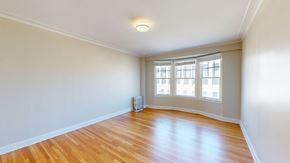 San Francisco apartment for rent - A room with wooden flooring and a window with blinds.