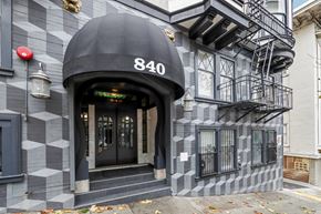 San Francisco apartment for rent - The front of a building with the number 840 on it.