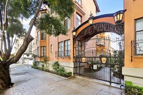 San Francisco apartment for rent - A street view of a building with a sign that reads "The Manor".