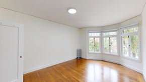 San Francisco apartment for rent - A room with a white door and a radiator on the floor.