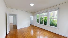 San Francisco apartment for rent - A room with wooden floors and white walls.