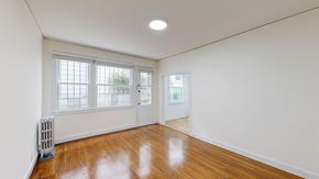San Francisco apartment for rent - A room with a white wall and a wooden floor.
