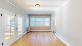 San Francisco apartment for rent - A room with wooden floors and white walls.