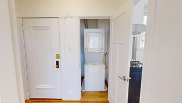 San Francisco apartment for rent - A white door is open to a small kitchen.