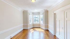 San Francisco apartment for rent - A room with wooden floors and white walls.