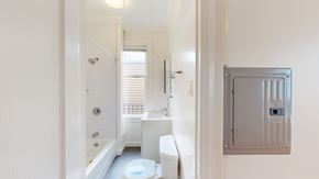 San Francisco apartment for rent - A white bathroom with a toilet, sink, and bathtub.