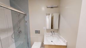San Francisco apartment for rent - A bathroom with a sink, mirror, and shower.
