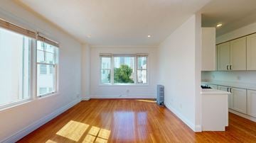 San Francisco apartment for rent - A room with wooden floors and white walls.