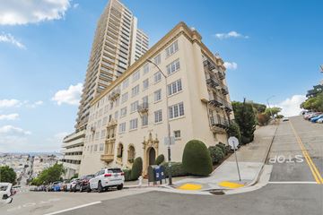 San Francisco apartment for rent - a large building on the corner of a city street
