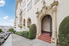 San Francisco apartment for rent - the side of a building with stairs and an arched doorway